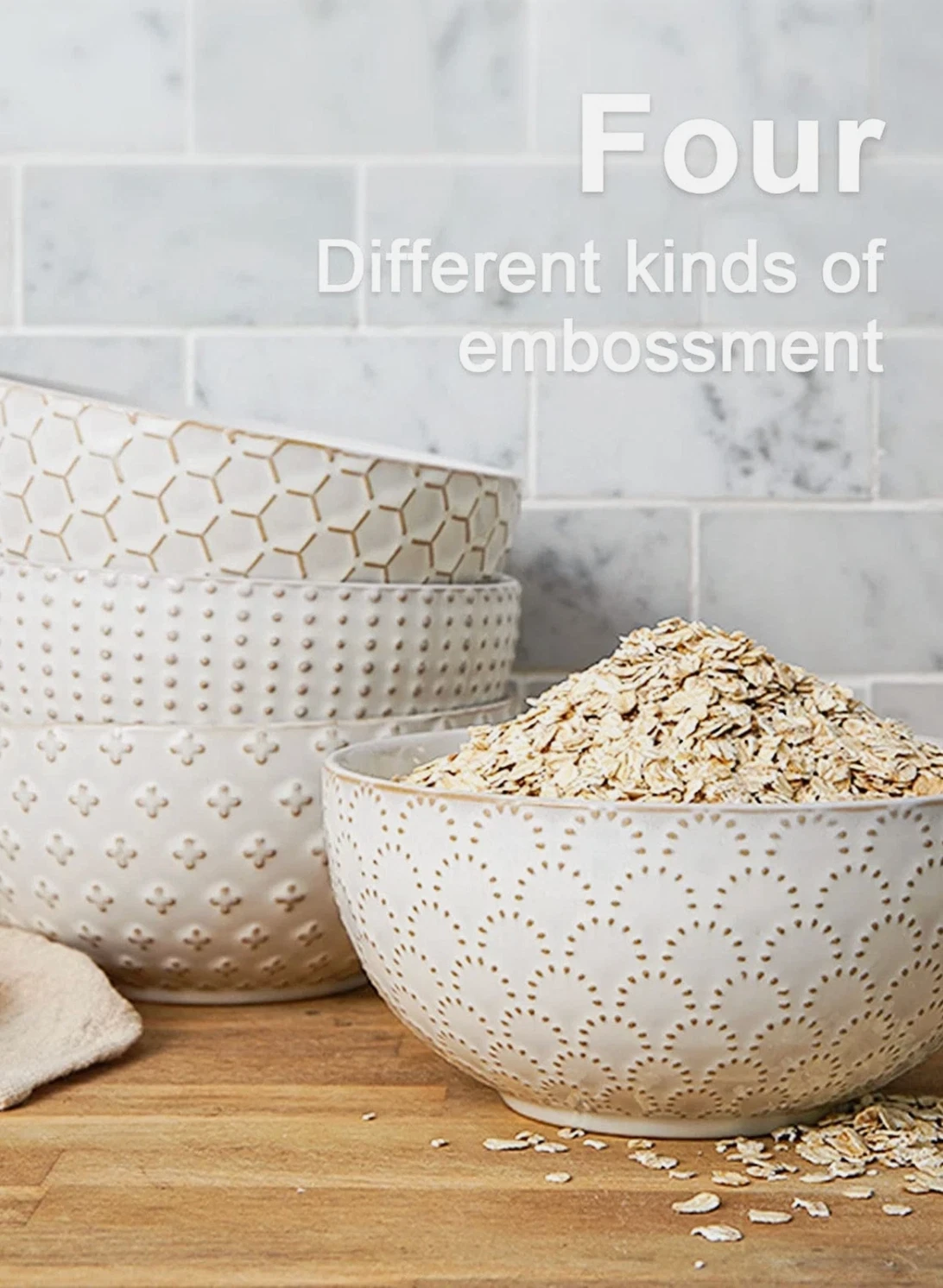 Le Tauci embossed white ceramic bowls four-piece set side view