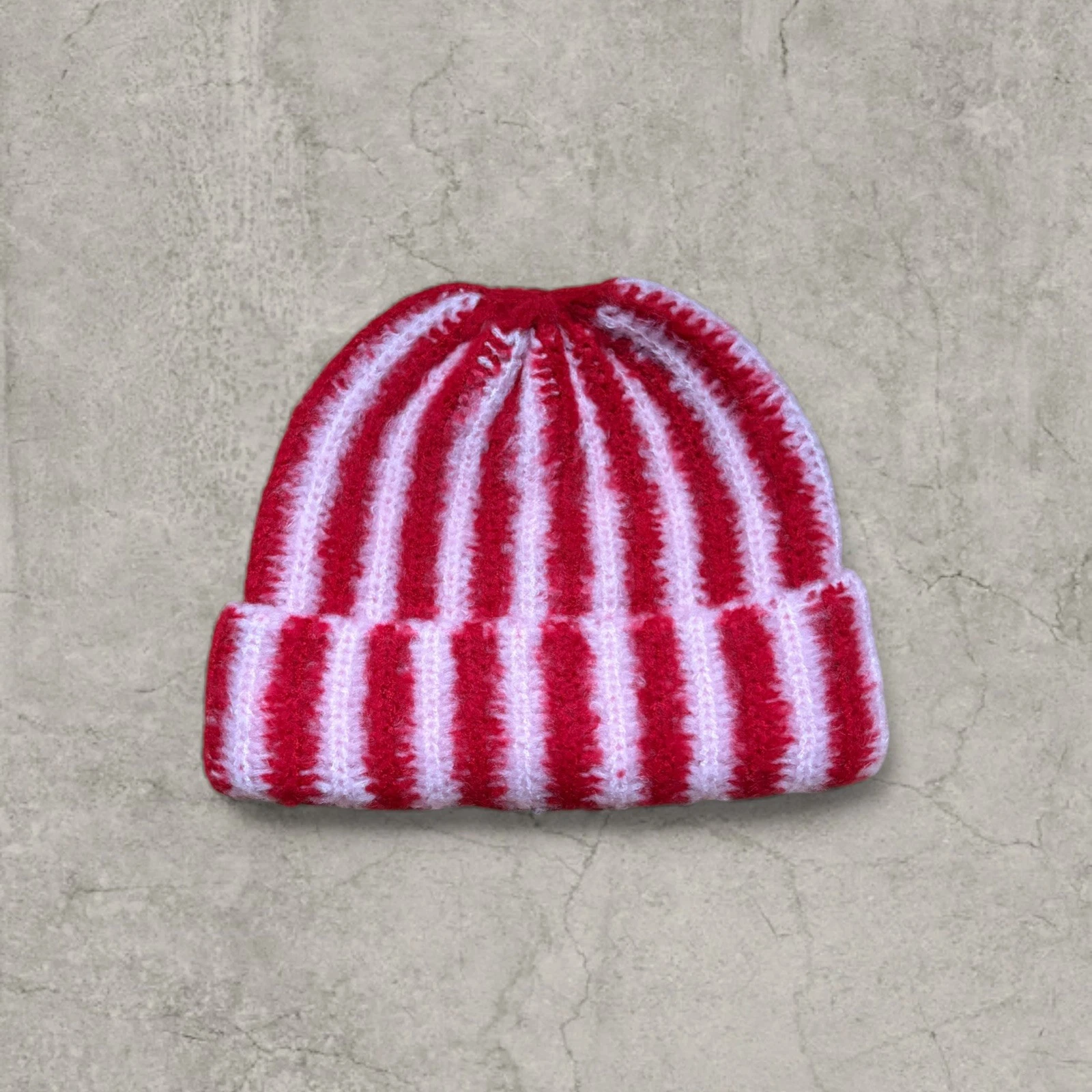 Cool pink and red striped beanie hat. One size