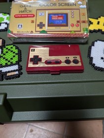 Excellent condition Super Mario Game & Watch (Nintendo) with bonus item.