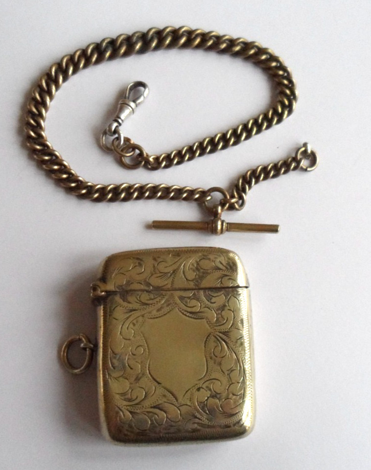 Antique white metal vesta case and a lightly gilded white metal Albert.