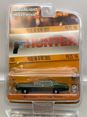 GREENLIGHT 44780C DODGE MONACO RICK HUNTER -GREEN 1:64- GOOD IN BLISTER - A012