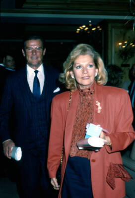 Married actors Roger Moore his wife Luisa Mattioli attend an event- Old Photo
