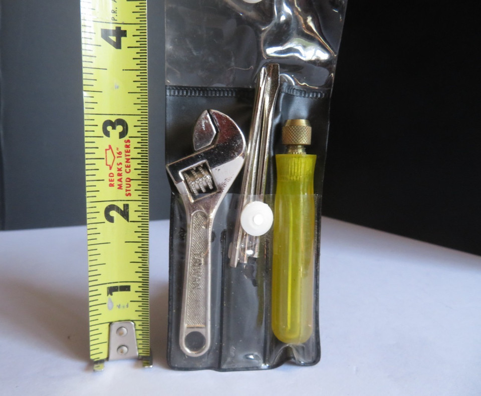 A genuine vintage Crescent-branded pocket tool kit — the kind of compact, all-in-one wrench/screwdriver/awl set that feels like it belongs in a time capsule from a hardware store's golden era.