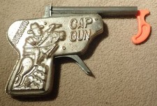 VINTAGE OM "AUTOMATIC" PRESSED TIN EMBOSSED CAP GUN