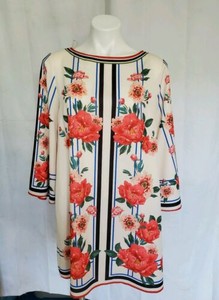 white dress with orange flowers