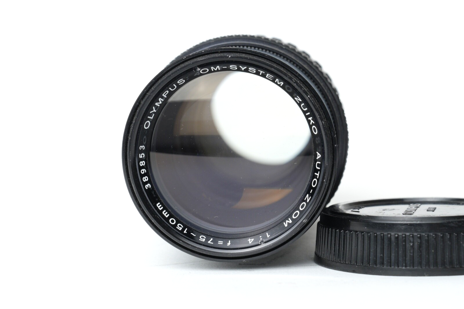 OLYMPUS OM System Zuiko 75-150mm f4 telephoto zoom lens with minor dust inside