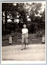 Vtg B&W Snapshot Smiling Woman In Skirt And Blouse By Fence And Woods 1940s