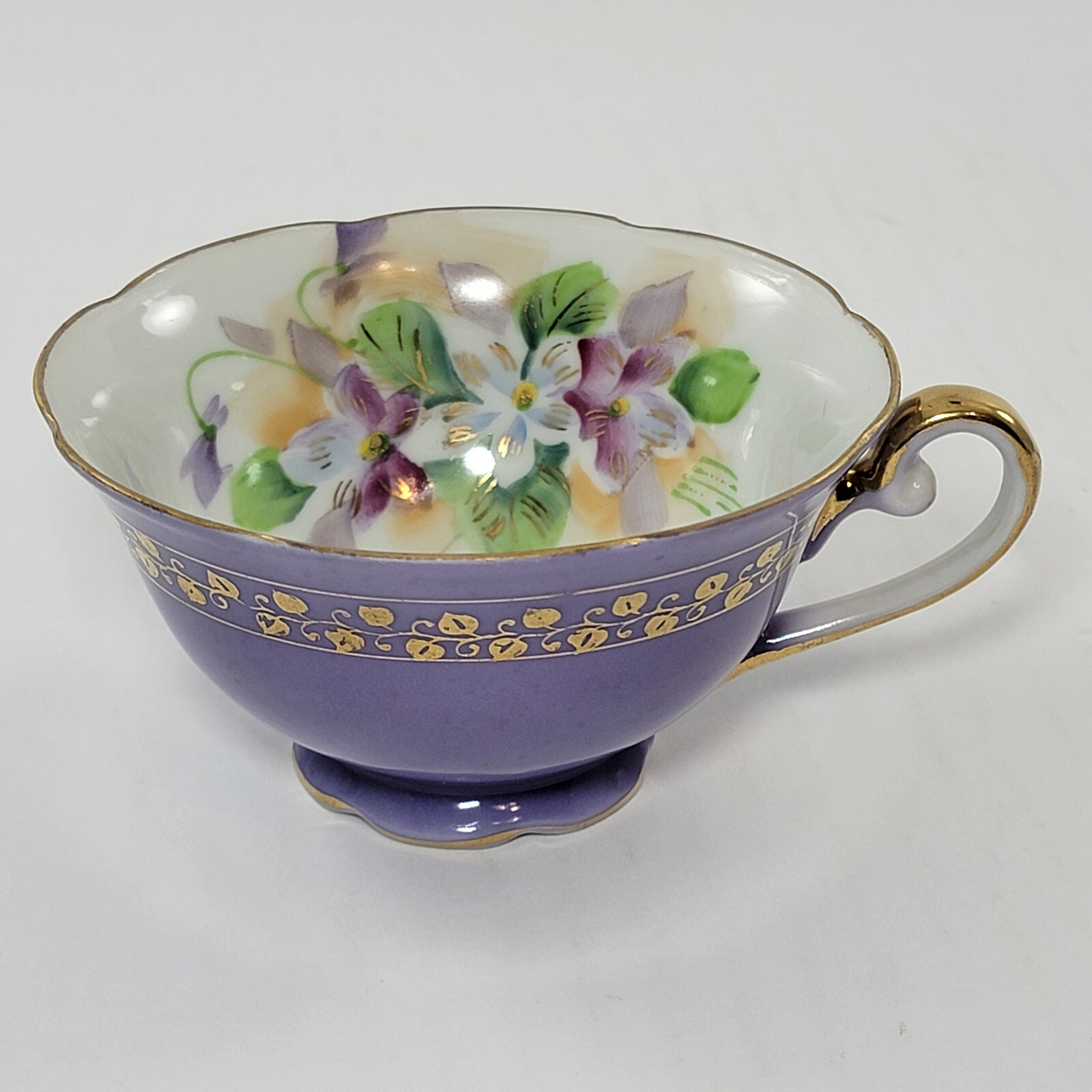 Saji made in Japan fancy China purple teacup with floral design and