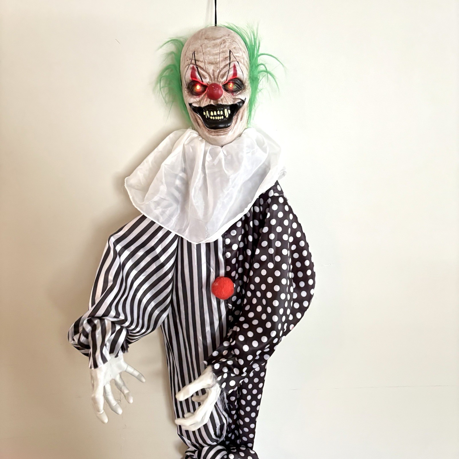 Animated Hanging Evil Clown Halloween Prop with Light-Up Eyes and Motion Sensor Sound