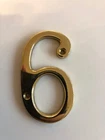 Unused Metal gold coloured number 6 or 9