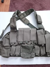 tactical chest rig, OD green, 7 rifle mags, New, molle loops.