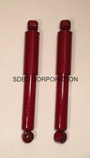 Shocks/ shock absorbers-short double eyelet 9.75 in compressed 14.75 in ext.