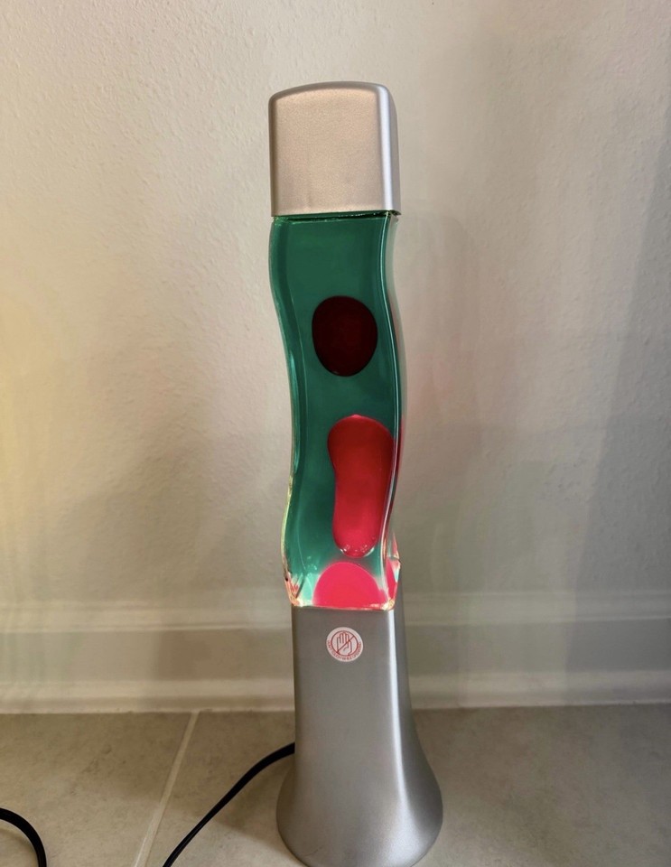 A hand-customized S-shaped lava lamp in forest green and red — one-of-a-kind retro art you literally cannot buy new.