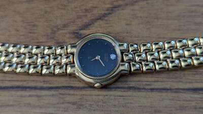 Citizen Womans Gold Color Watch, Black Face, Diamond style 12 o'clock accent