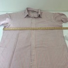 Pink and blue vertically striped LL Bean short-sleeve Oxford shirt with button-down collar, laid flat on white surface.