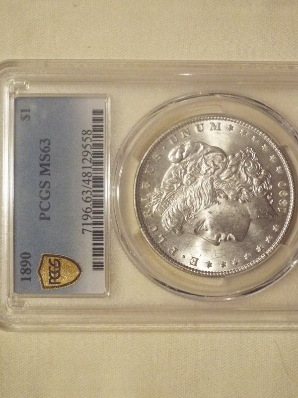 1890 PCGS MS63 Morgan Silver Dollar.