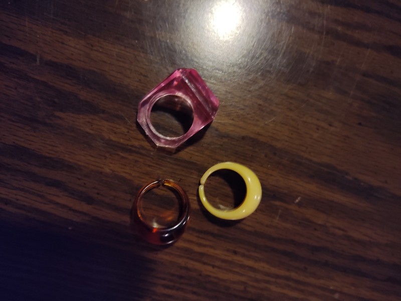 3 Bakelite Rings Bone, Rust And Pink Colored.