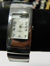 Lady's silver tone cuff clamshell/bangle style watch/wristwatch