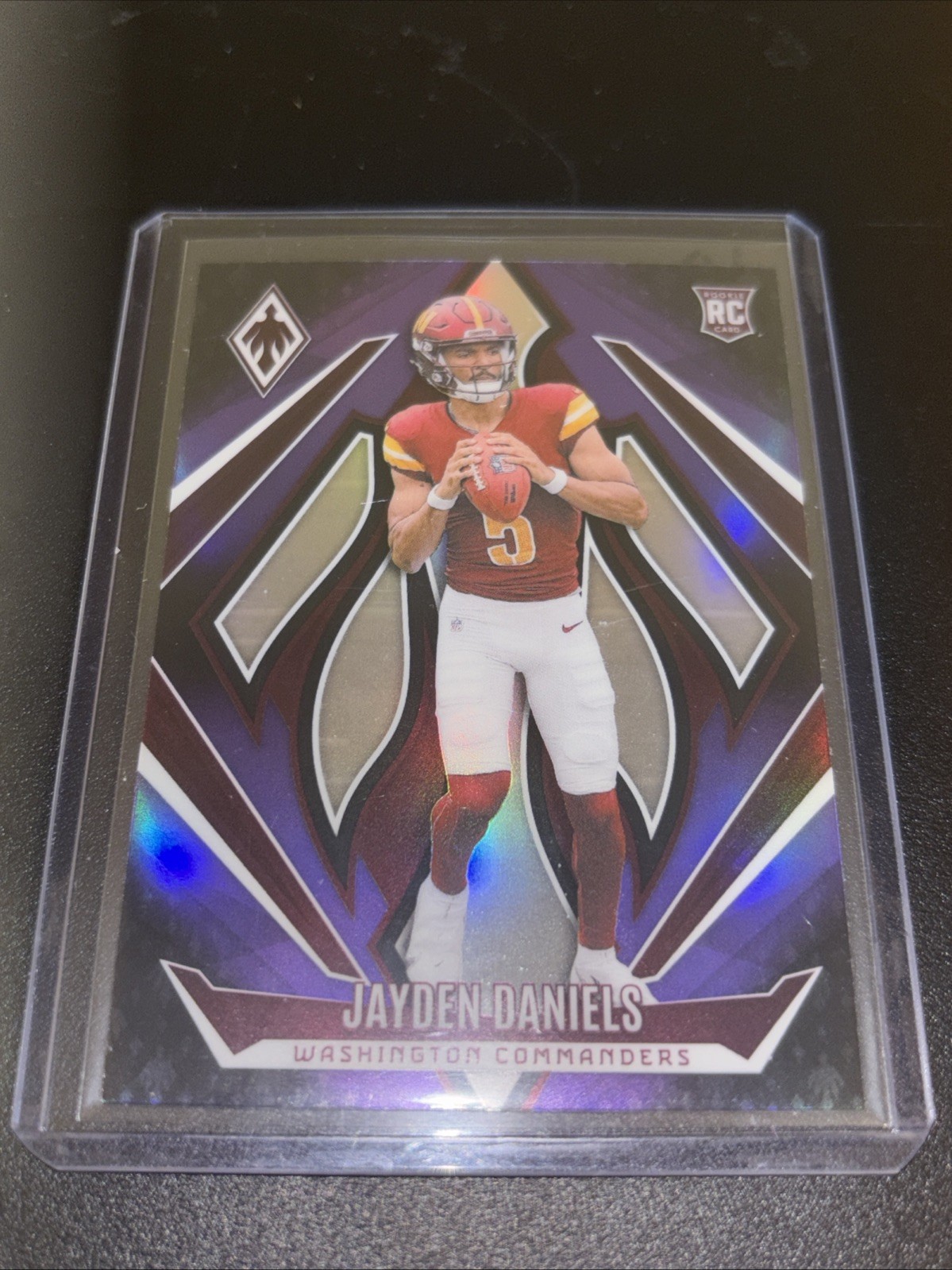 2024 Panini Phoenix - Rookies Jayden Daniels #198 Purple Fade (RC)