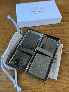 vivienne westwood cigarette case and lighter lighters a portable ashtray! Vivienne definitely thinks of everything!  Photos from @culted, @sickboyarchive, @teenageandsexual, @das.archivee and @chromeg1rl! #viviennewestwood #viviennewestwoodlighter #archive #nana dpa files) - British fashion
