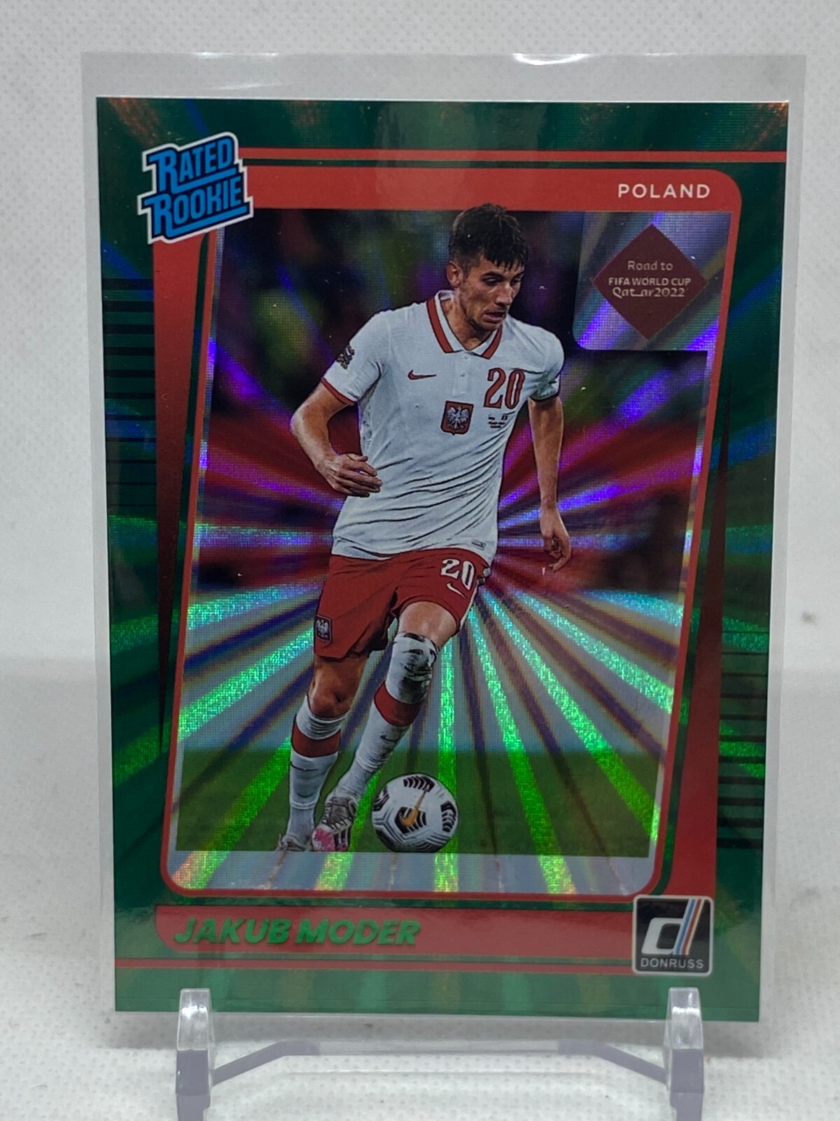2021-22 Donruss Jakub Moder Rated Rookie Green Laser RC Poland Road to Qatar