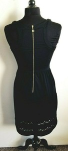 black dress with gold zipper in back