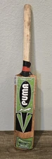 Wooden Cricket Bat with Puma Ballistic Stickers on it