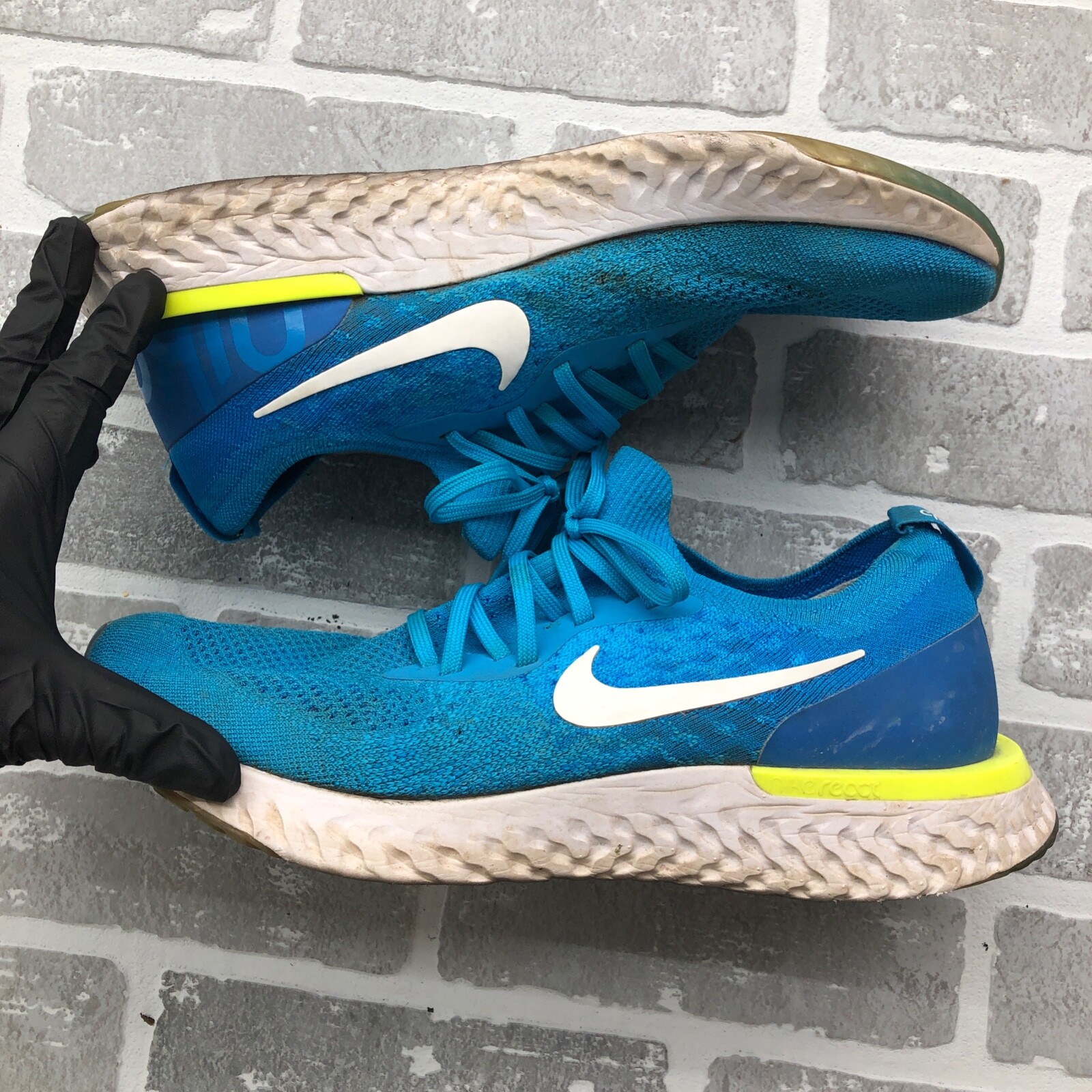 white and blue nike epic react
