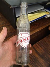 ACL SODA BOTTLE STANLEY BEVERAGES SHIELD LOGO . WISCONSIN WI WIS . 1949