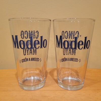 Lot of 2 Modelo Cerveza CINCO DE MAYO Beer Pint Glasses Maracas Blue Logo Set