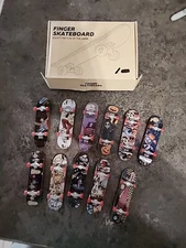 Deck lot of 11 Finger Boards Skateboards. Various Styles Of Artwork!! SEE PICS!!