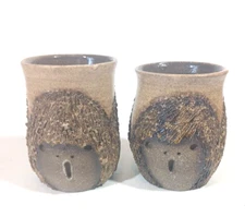 2 Brown Stoneware Pottery Ugly Face Mug Cup Choir Singer Signed 3 faces Vintage