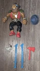 TMNT Vintage Bebop with trashcan lid and other misc. TMNT weapons