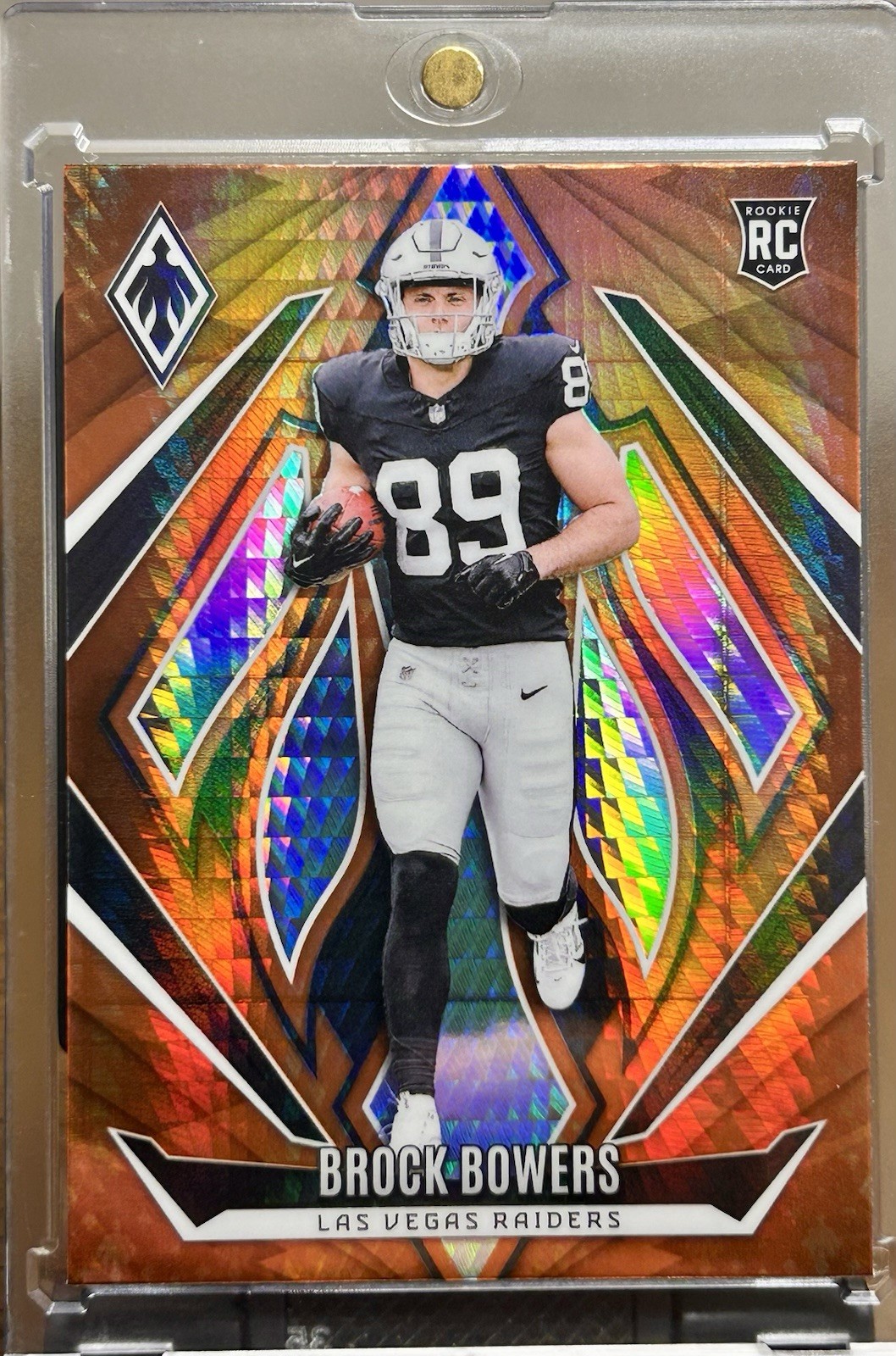 2024 Panini Phoenix - Rookies Brock Bowers #165 Orange Hyper (RC)