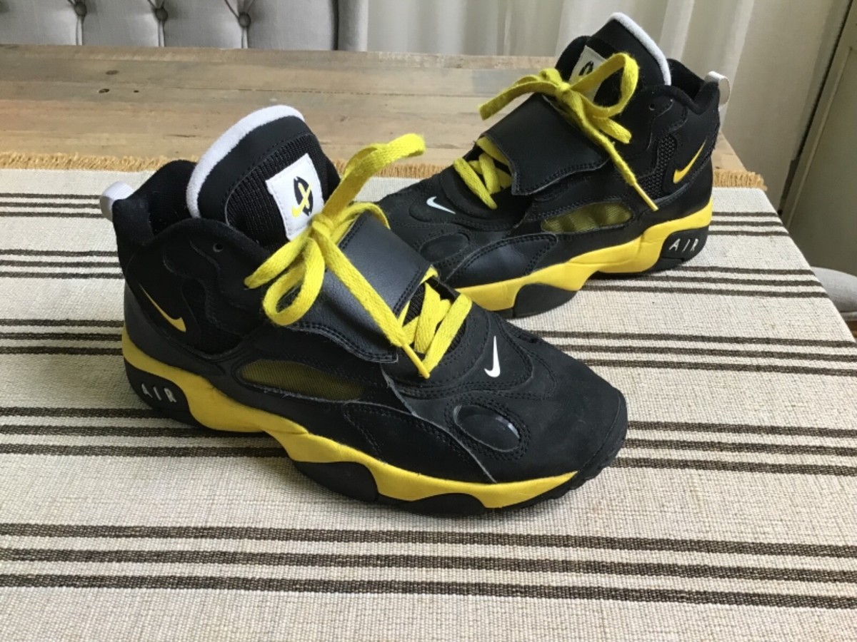 yellow and black nike turf