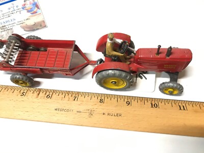 A Dinky Toys No. 27A Massey-Harris Tractor original yellow card trade