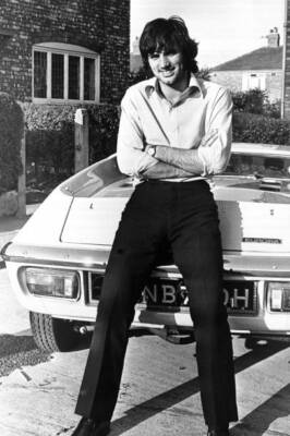 Footballer George Best seen here outside his Manchester home leani- 1969 Photo