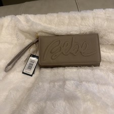 NWT BeBe Logo Trifold Wristlet Wallet Taupe Vegan Faux Leather  Ret 59.00