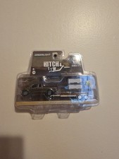 Greenlight - Hitch  Tow - 2015 Ford F-150 and Flatbed Trailer - 1:64 - New
