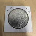 E Pluribus Unum Silver Coin is a 1885 Morgan silver dollar