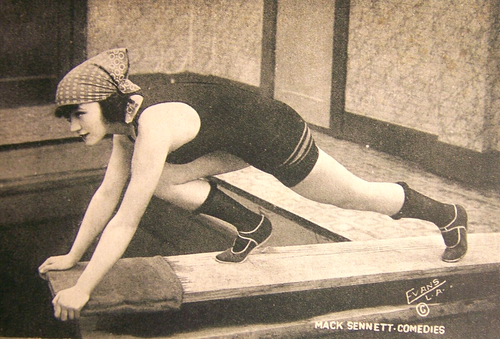 C. 1915, Mack Sennett Studios, Marie Prevost, Mabel Normand, on a diving board - Picture 3 of 4