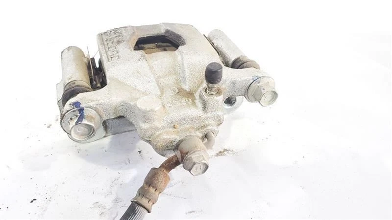 Nissan Altima 2019 2020 pinza de freno trasera izquierda OEM sin estacionamiento eléctrico  Foto 4 de 4