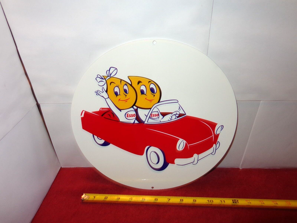 VINTAGE 11 3/4 in ESSO OIL DROPS DRIVING A DROP TOP ADV. SIGN