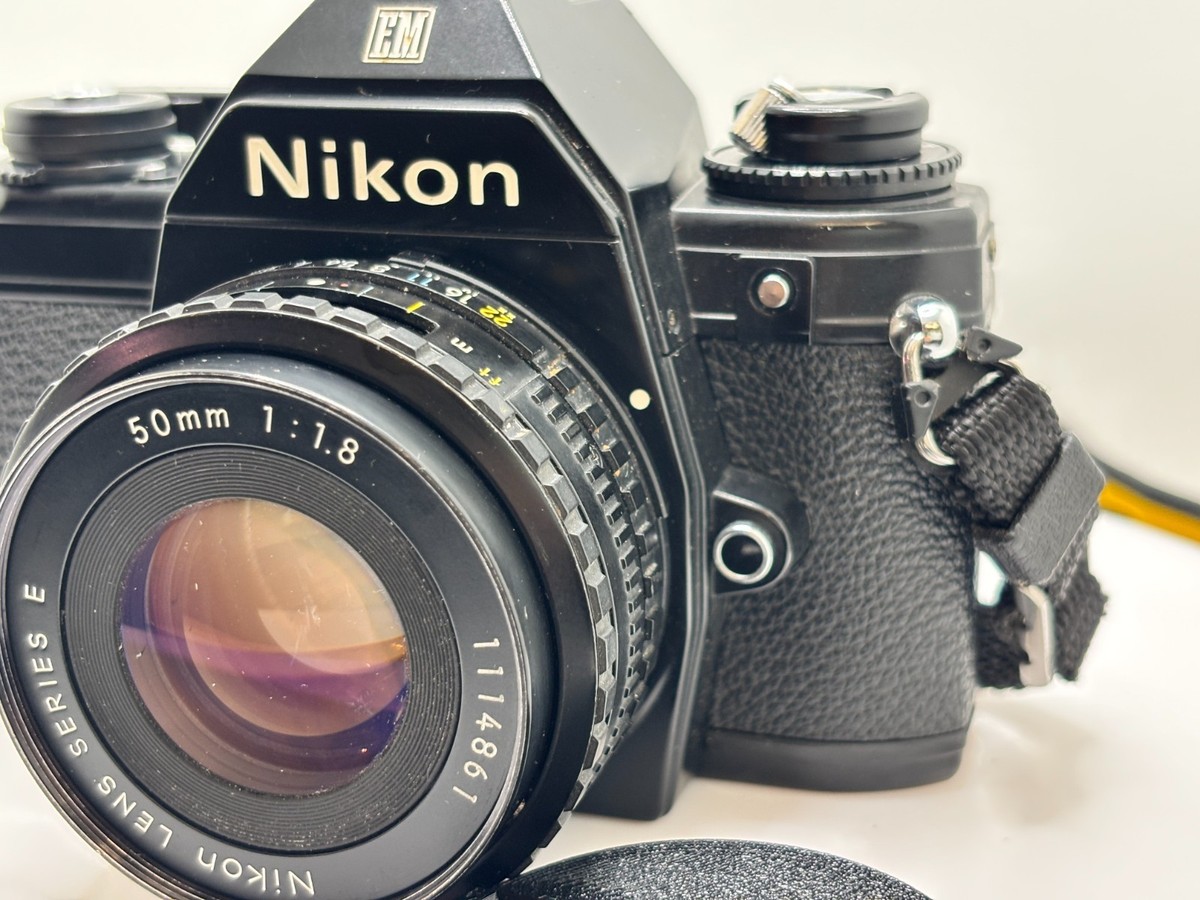 Nikon EM Film Camera: with Nikon with 50 & 75-150 mm lenses