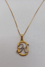 gold & silver-tone letter initial necklace cursive K pendant on a box chain