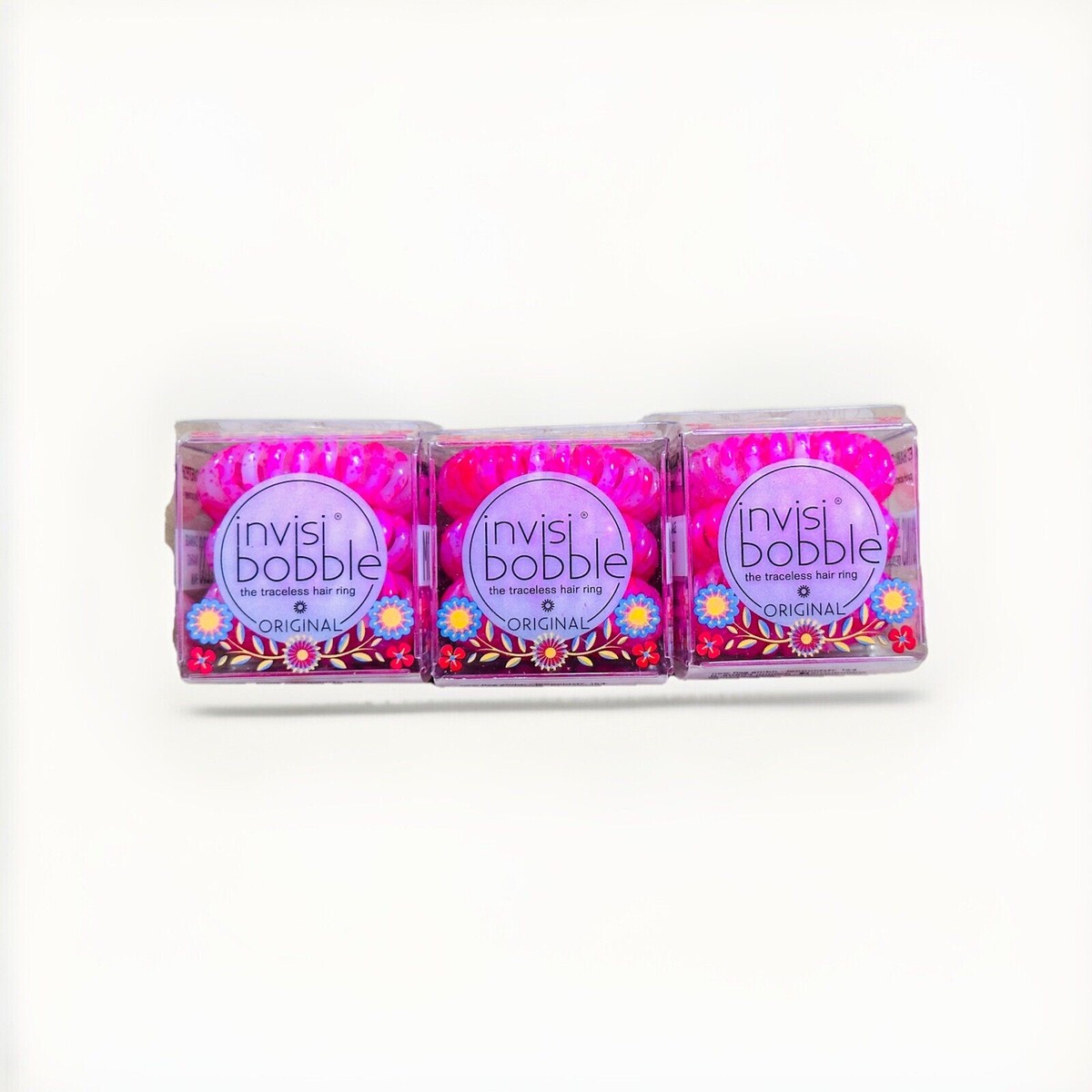 A pack of pink invisibobble ORIGINAL traceless hair rings.