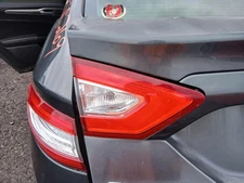 Used Left Tail Light Assembly fits: 2015 Ford Fusion lid mounted Hybrid SE L. Le