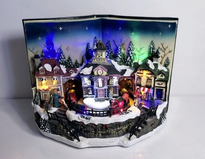Range Winter Wonderland Weihnachtsdorf Musikzug Szene im offenen Buch LED