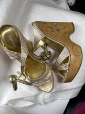 Report “Tattoo” Signature Wooden Wedge High Heels With Abalone Type Accents.