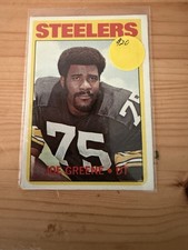 Vintage sports card lot including NFL and MLB cards from the 1960s and 1970s era